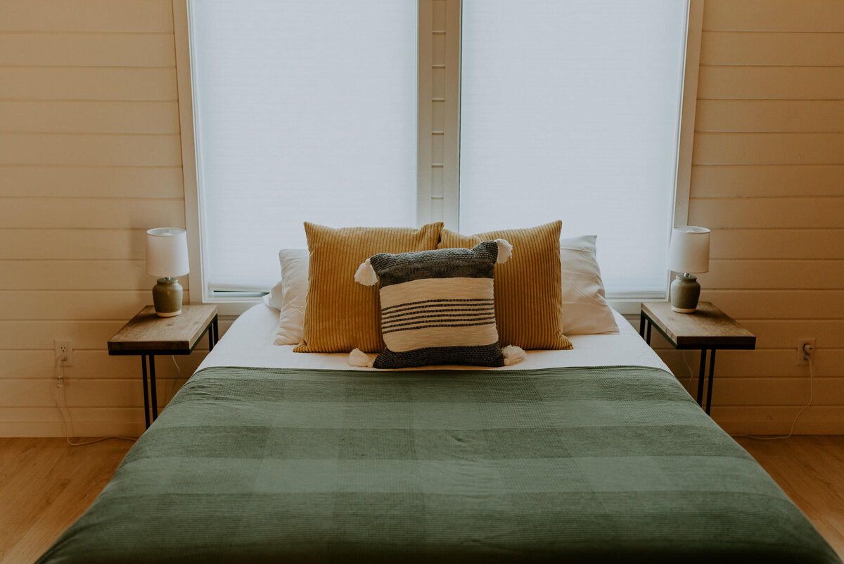 Bedroom inside of aframe cabin.
