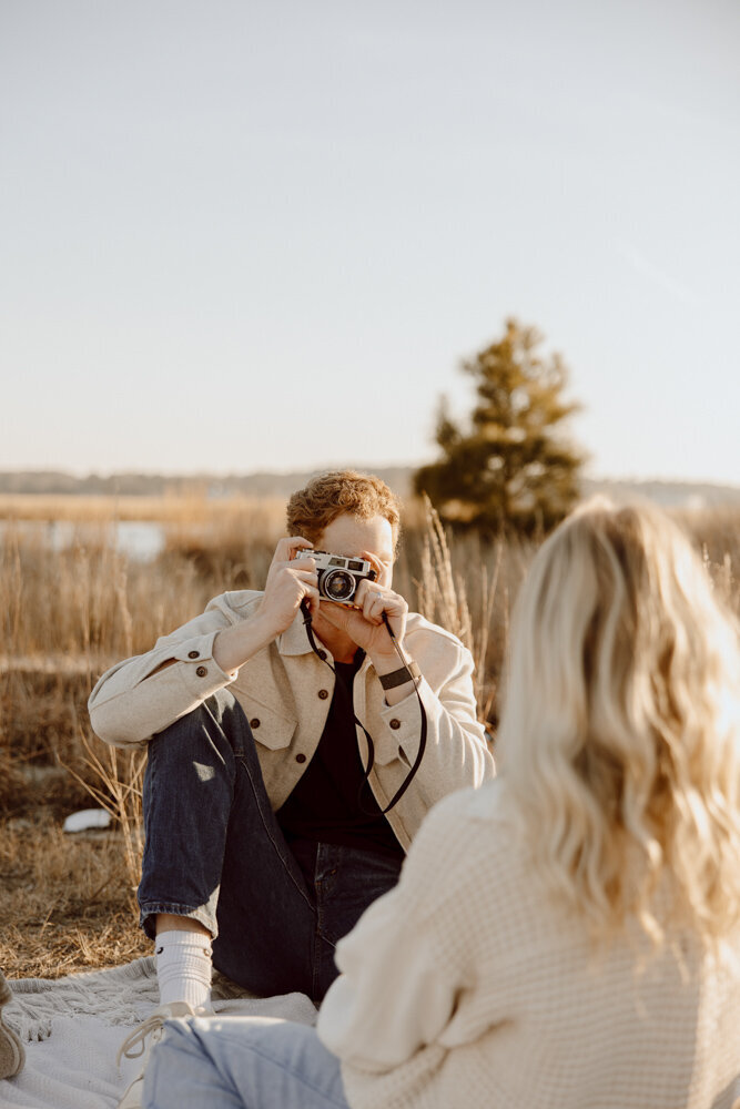 Couples session using vintage cameras in Virginia Beach, VA.