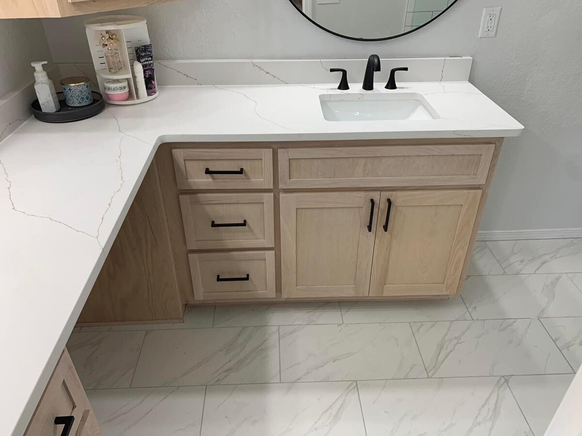 Bathroom renovation with light wood cabinets in northwest arkansas
