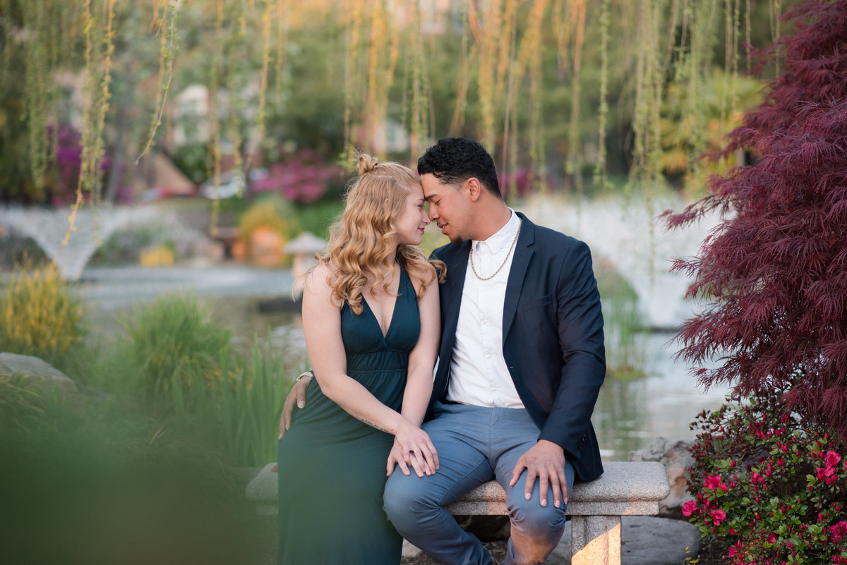 couple kissing during pagoda garden engagement session by norfolk virginia photographer