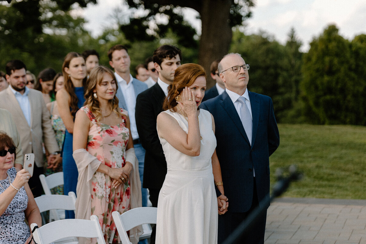 mom crying at wedding ceremony