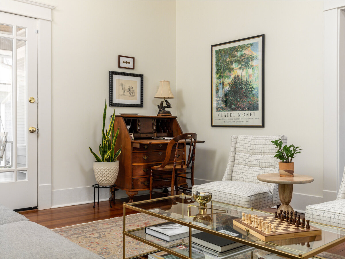 rebekah nicole interiors living room with vintage desk and glass table