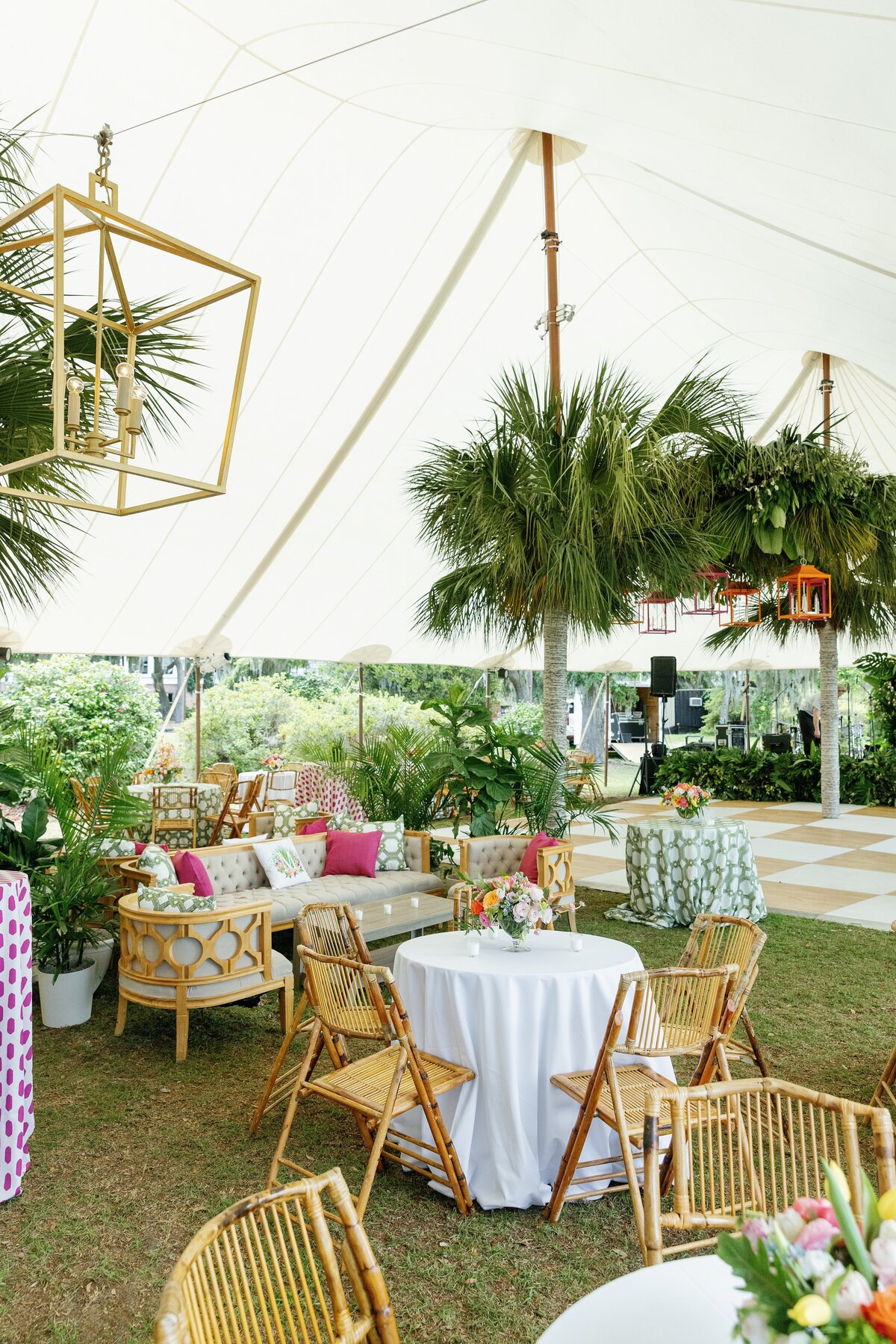 tropical reception design under a sail cloth tent in charleston sc