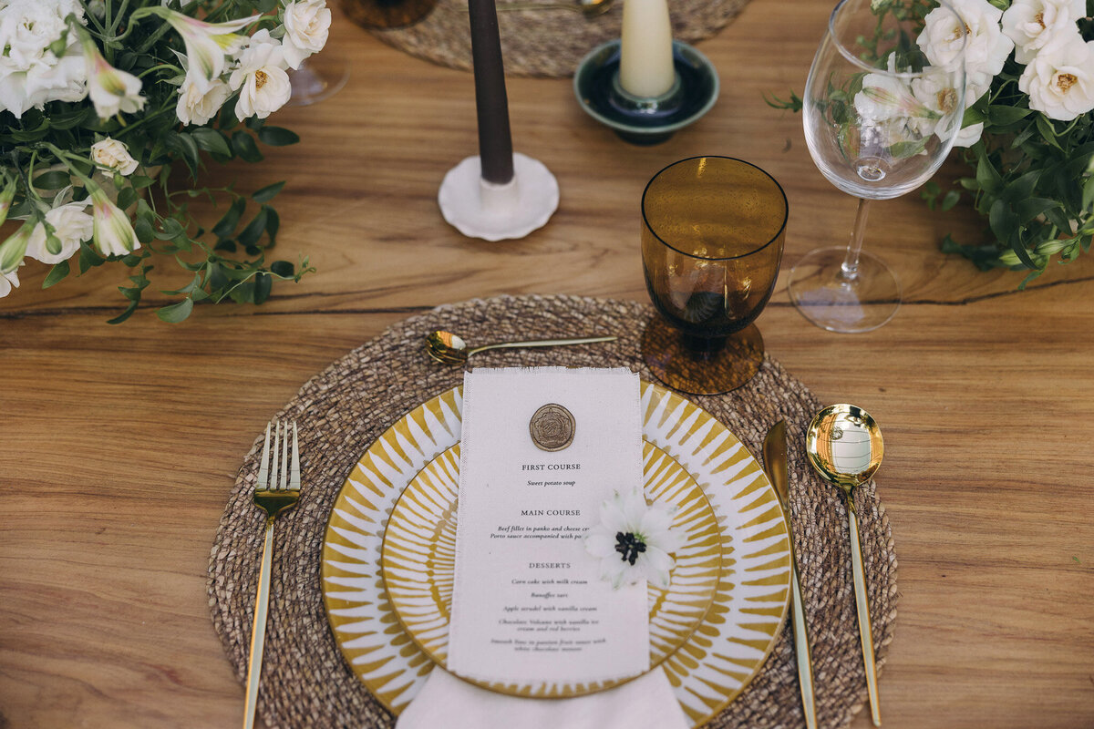 Rustic Tuscan wedding table with setting in brown, gold, ivory 