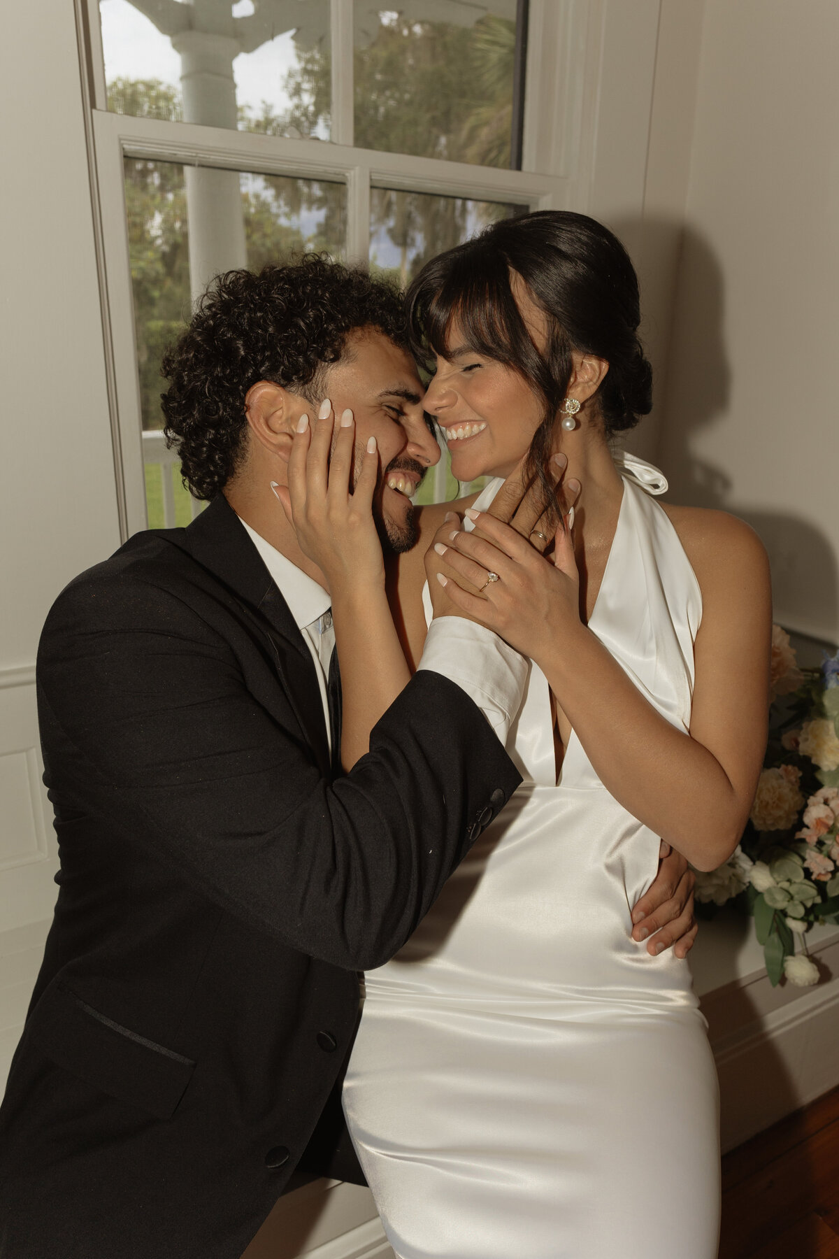 Luxury Florida wedding surrounded by tall palm trees and tropical details at The Palm Mansion in Umatilla