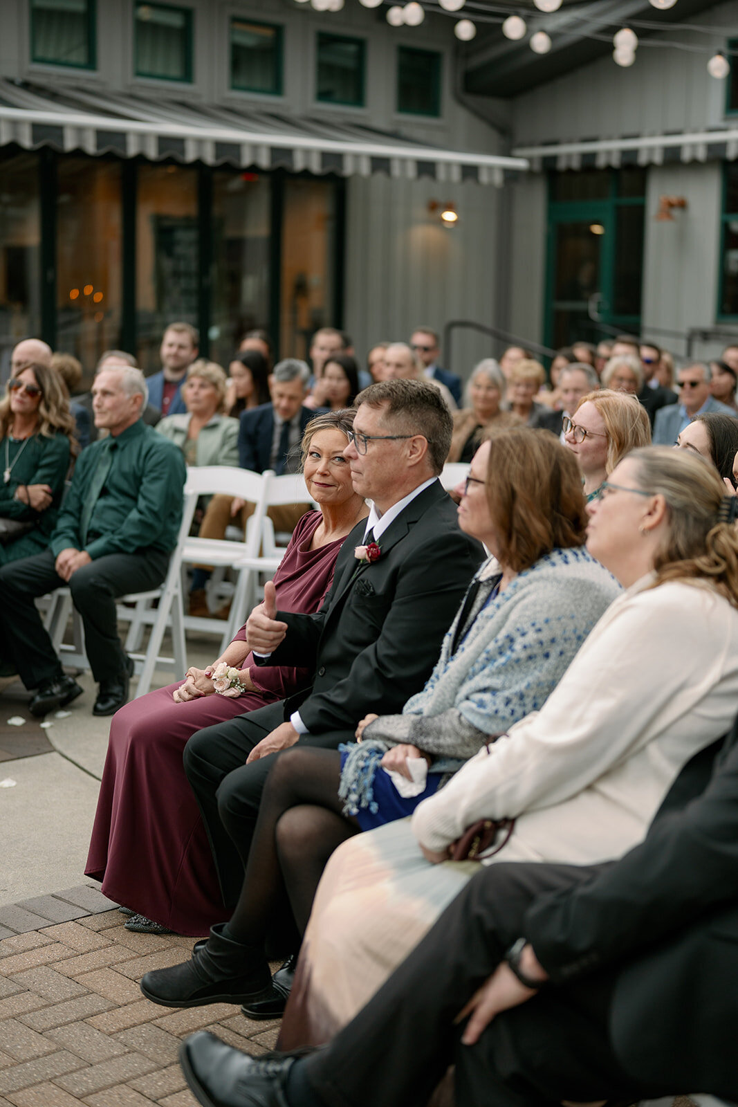 a mother reacting to her daughters wedding at outdoor michigan ceremony at Boatwerks in Holland, MI