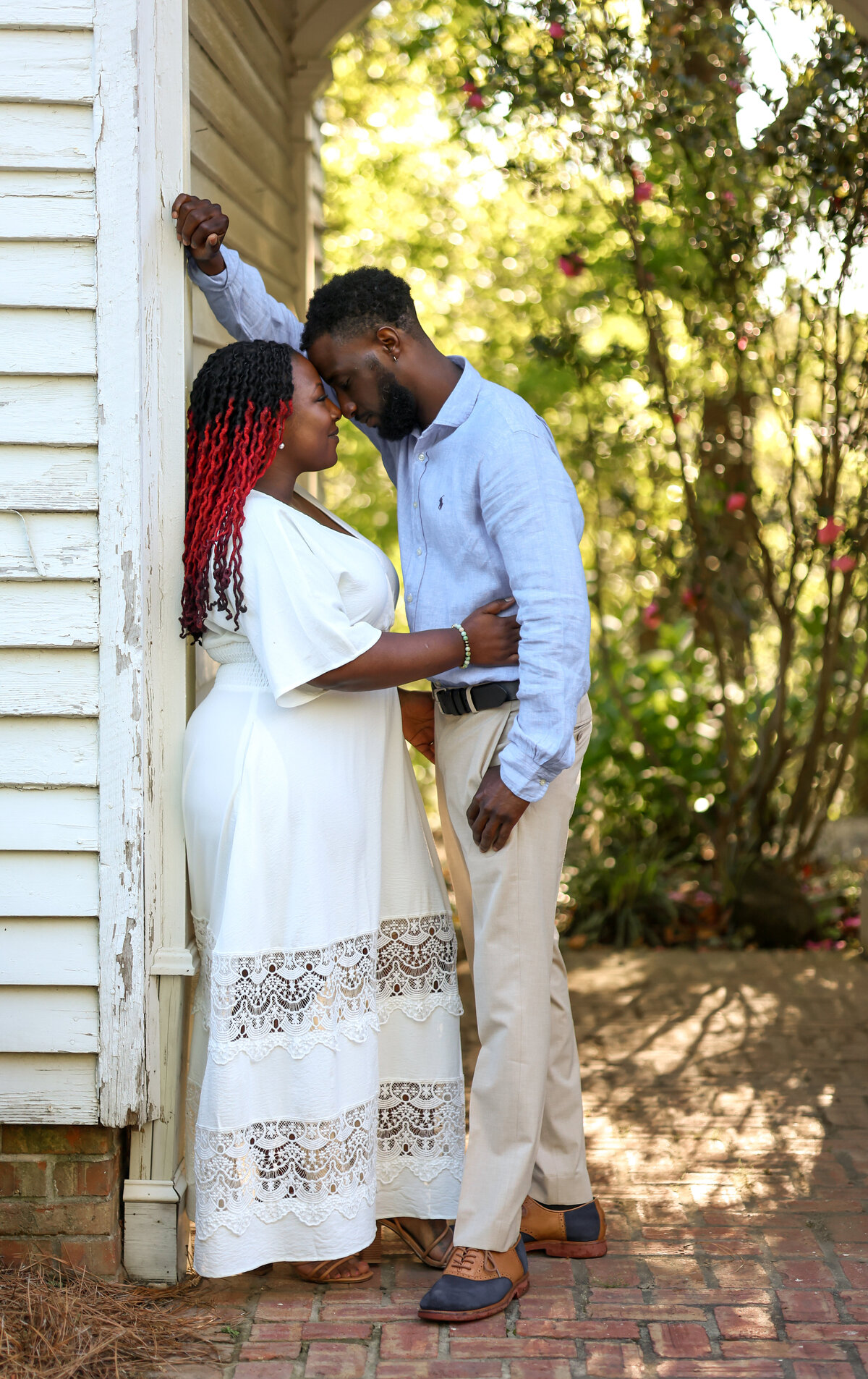 black couple looking at each other at Columbus Botanical Garden by Columbus Georgia engagement photographer