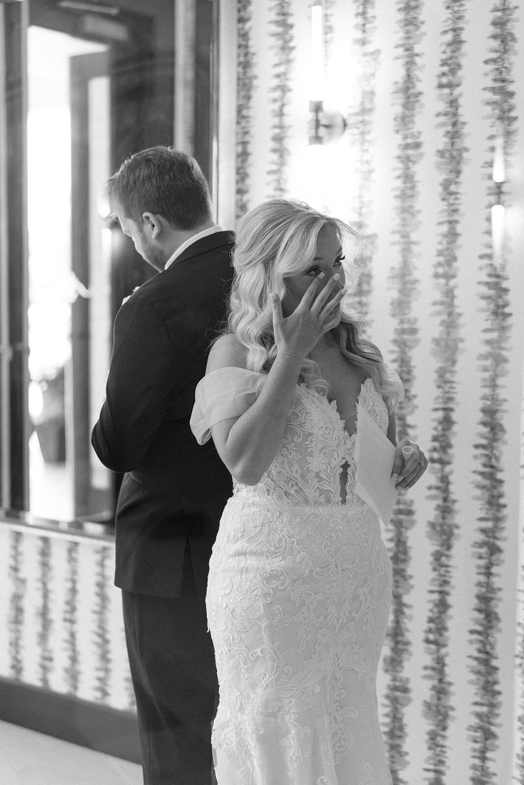 Bride and groom at Memorial Presbyterian Church in St. Louis, holding hands during their first touch