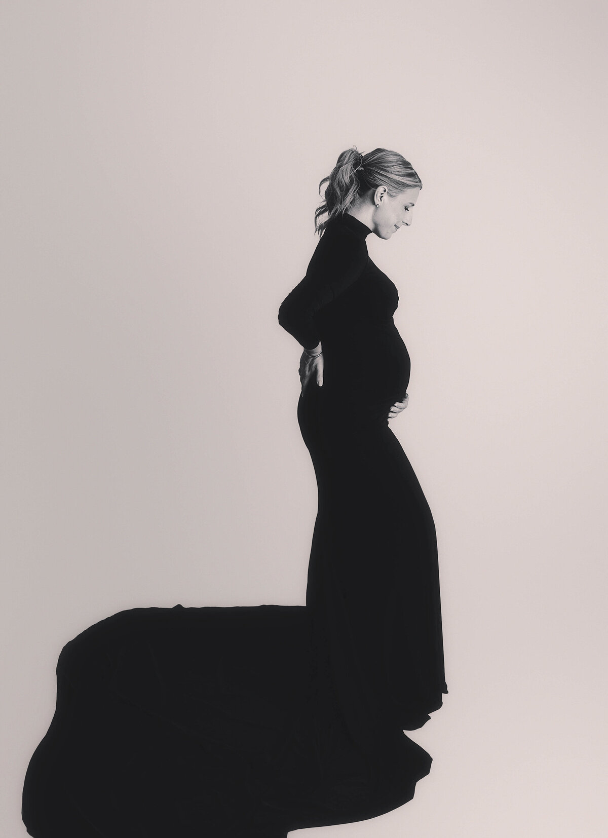 Expecting mother poses for Studio Maternity Photos in Charleston.