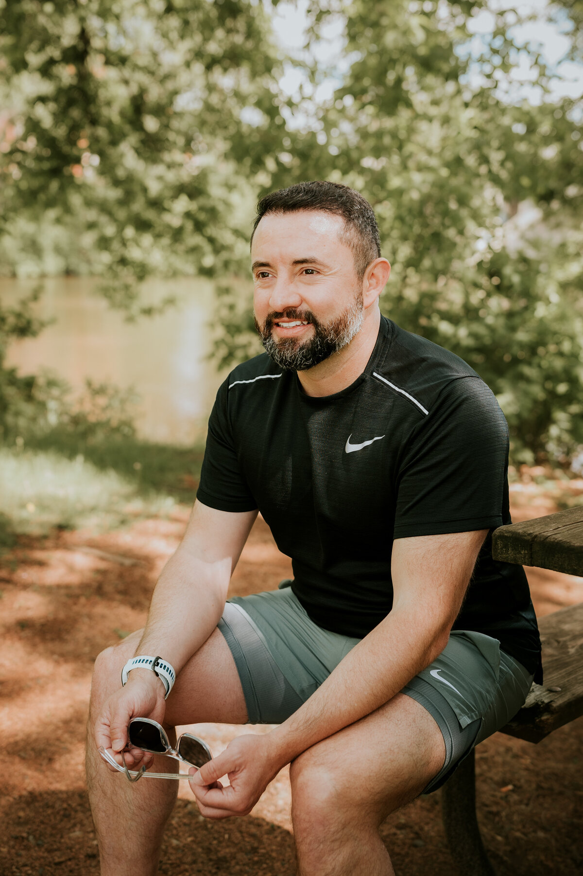 A confident man photographed outdoors in natural light by a Minneapolis online dating photographer, perfect for a polished dating app profile.