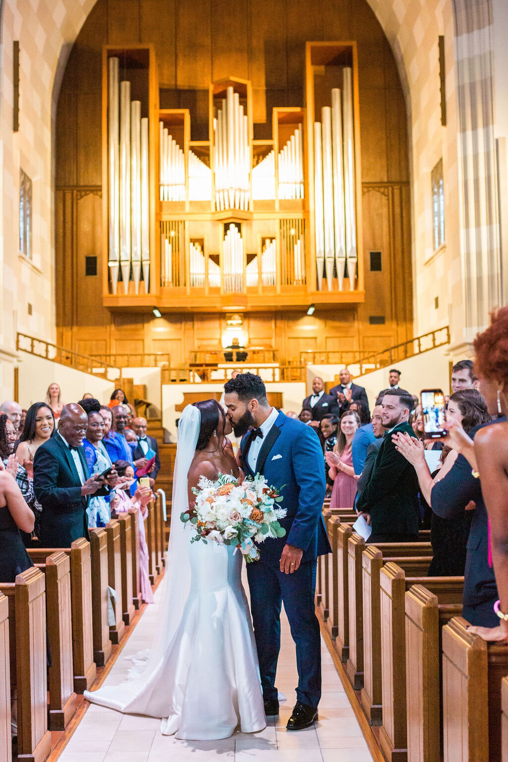 bride and groom kiss wedding