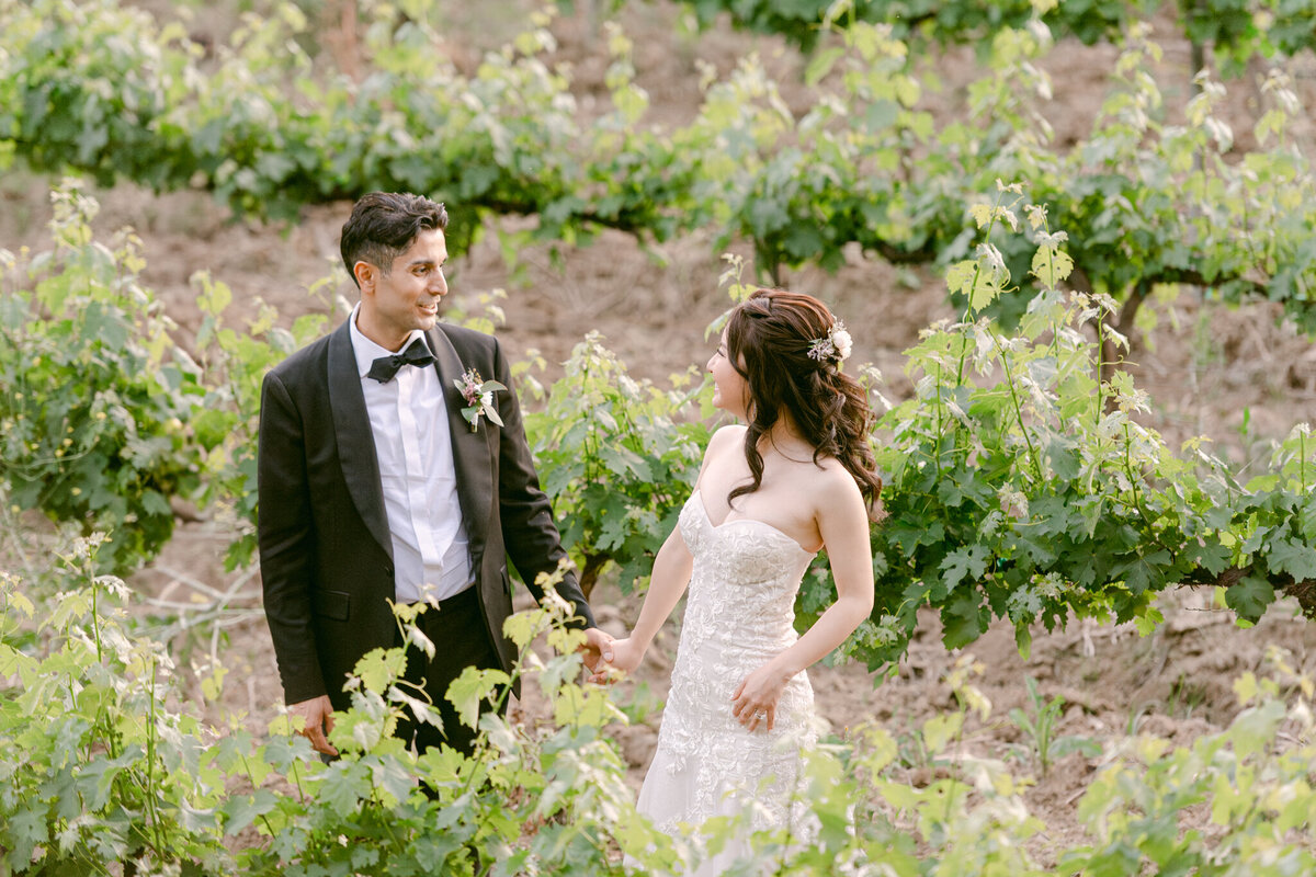 An unforgettable wedding moment surrounded by lush bougainvillea and golden light—captured with soft elegance by Los Angeles Top Destination Wedding Luxury Photographer Michael Asmussen. From Temecula Valley Wine Country to Tuscany, Italy this image embodies timeless beauty, couture bridal styling, and modern romance with a soulful lens.
