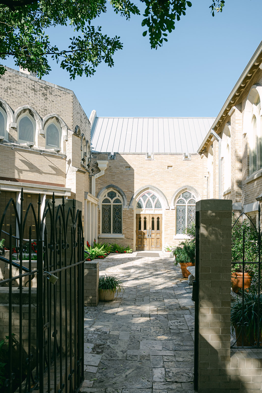 Editorial wide shot of ornate cathedral architecture in downtown San Antonio, perfect for luxury religious ceremonies