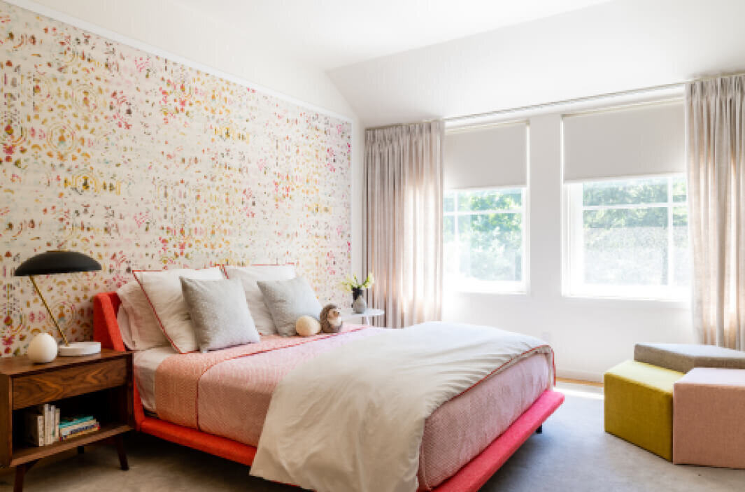 Kids' bedroom interior design in a Hingham modern home features Elitis wallpaper, a pink nook bed by Blu Dot, and colorful bedding by interior decorators in Boston.