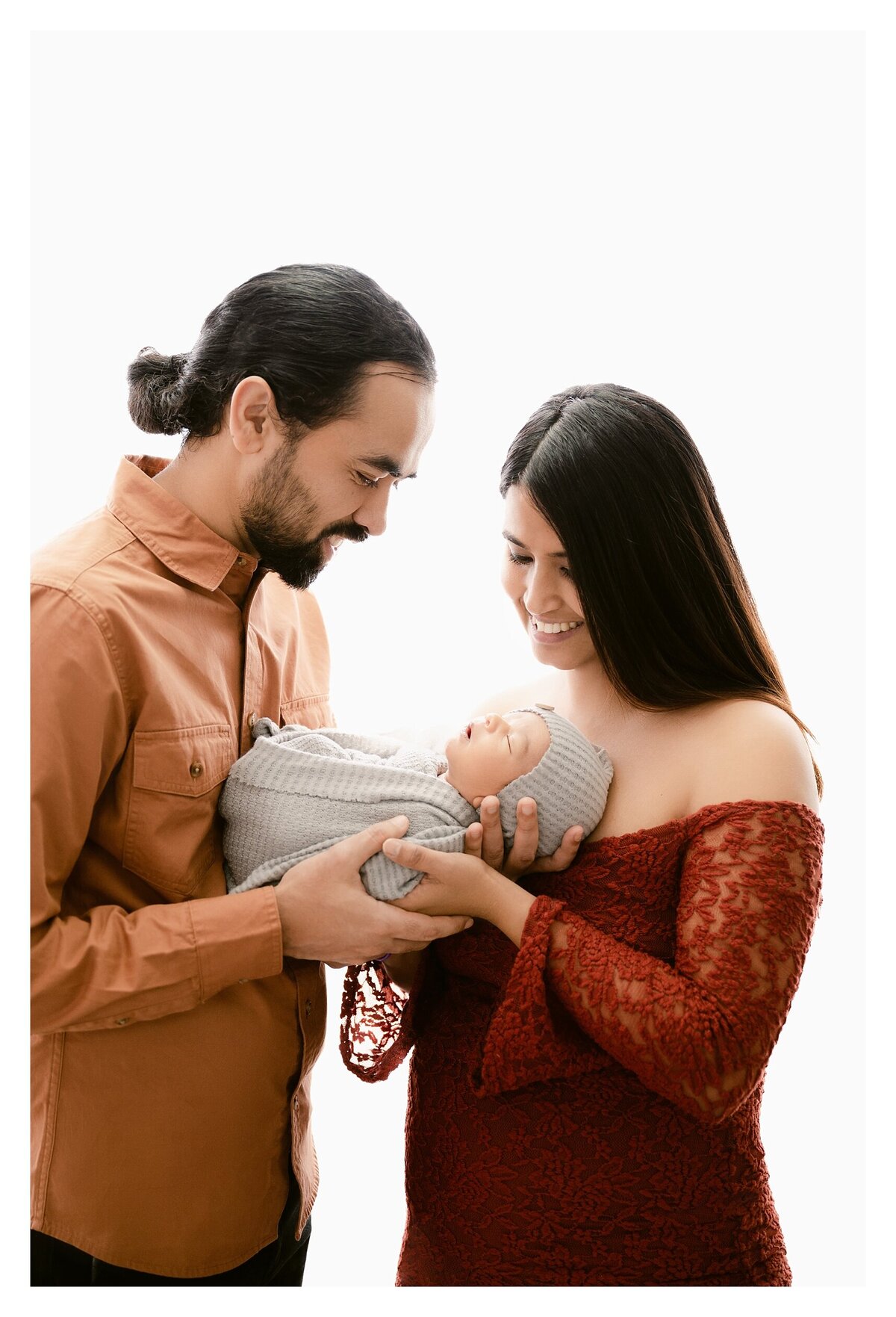 Anoka MN Newborn Photographer | Earth tones | neutrals | backlighting red and rust with newborn | Mom and dad with baby | Newborn Photographer MN