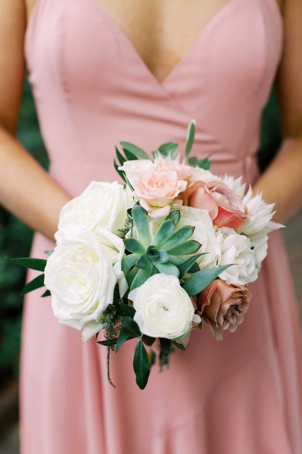Romantic bridesmaids bouquet with succulents and  soft pink bridesmaids dress at a luxury Chicago outdoor garden wedding.