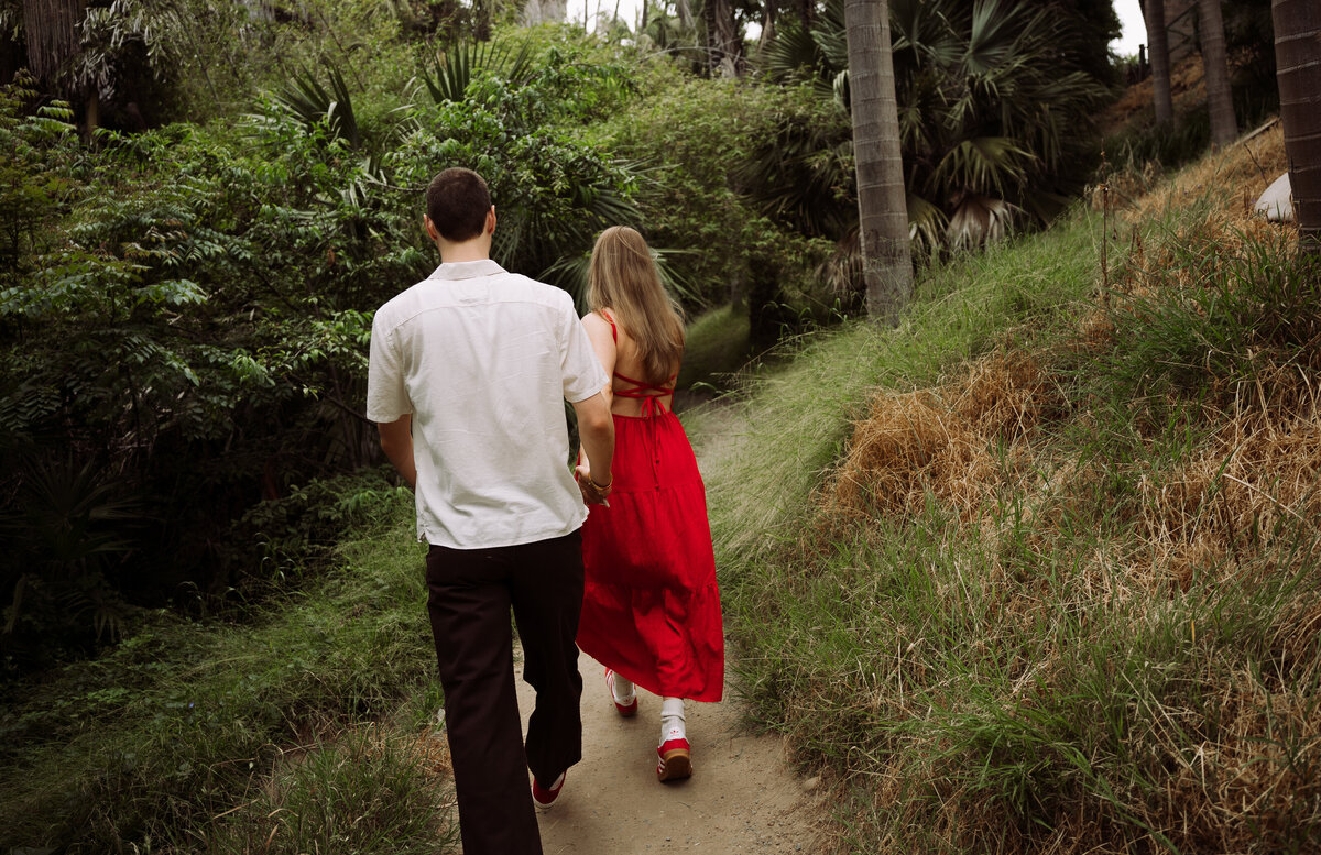 couple walking down nature trail