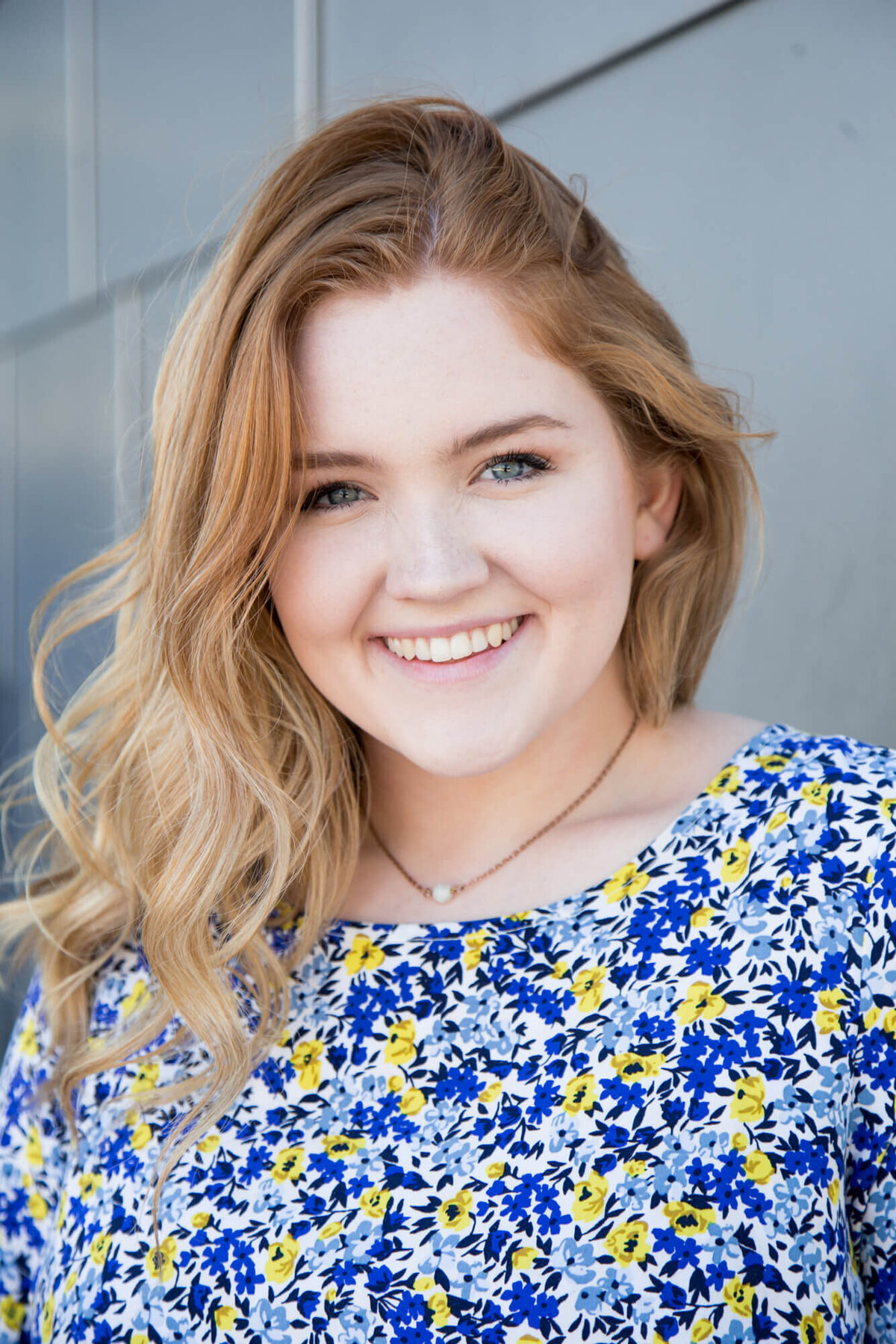 Senior girl smiling during her session with las vegas milestone photographer Jessica Bowles