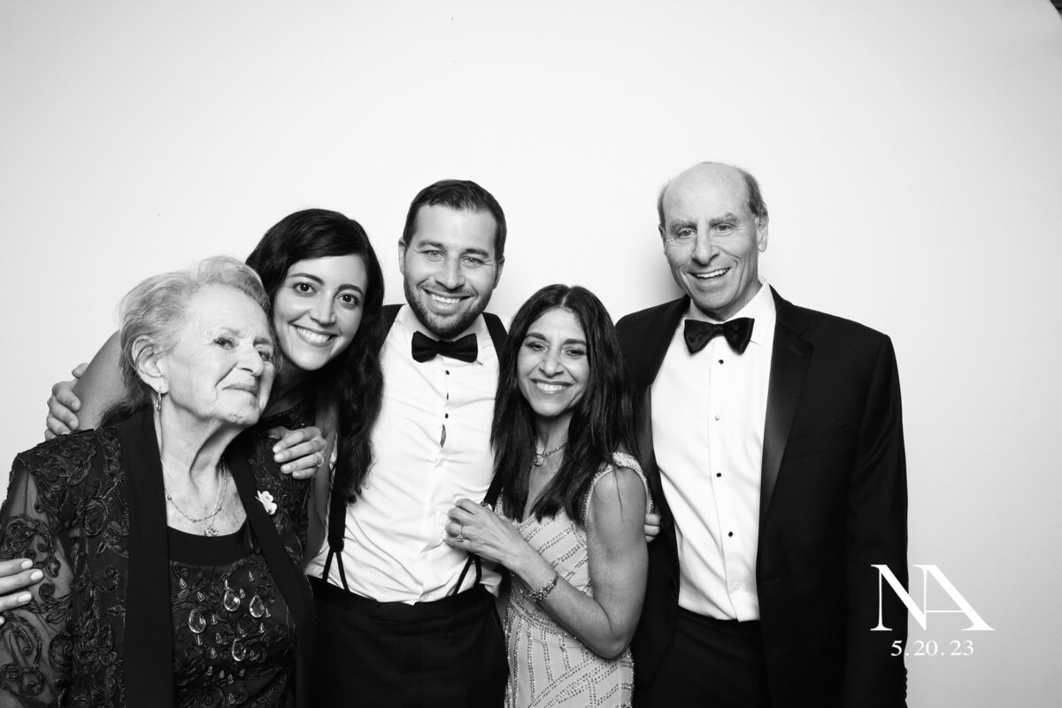 family poses at wedding