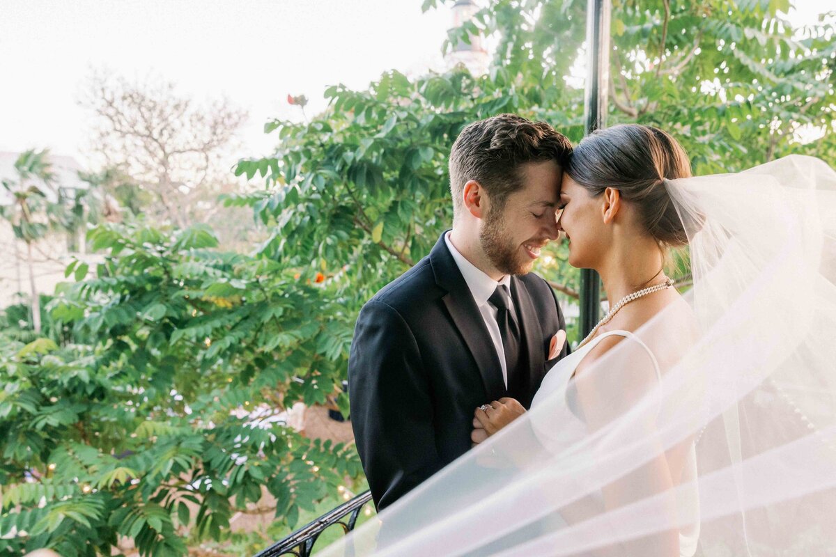 A bride and groom holding hands at their Tampa wedding at The Orlo House