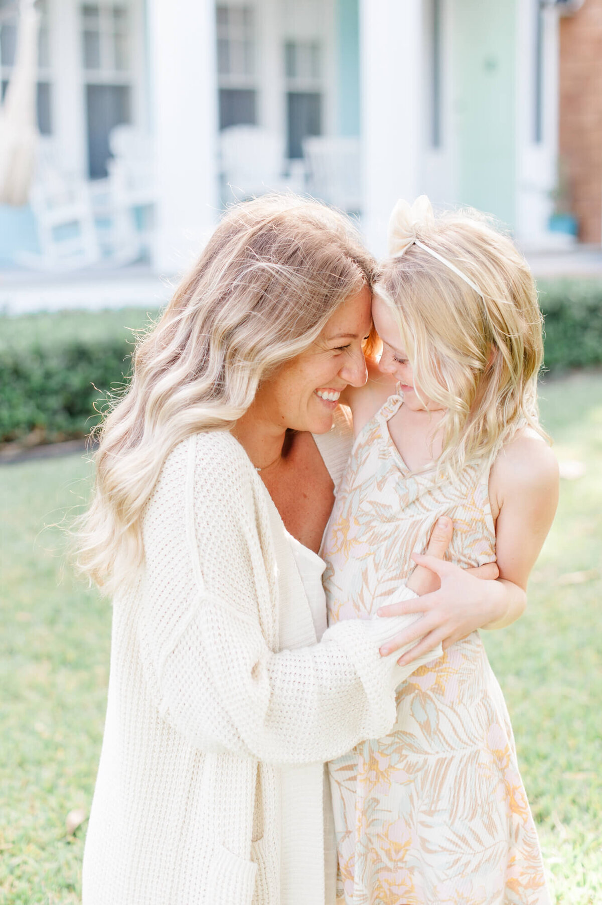 Mom holds daughter in a tight embrace