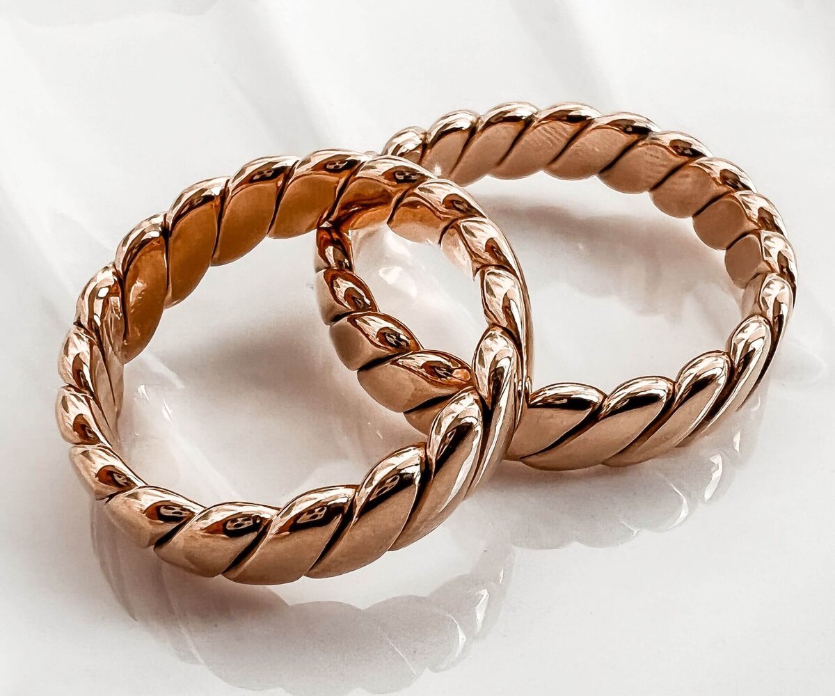 Couple of Golden Rings on White Background