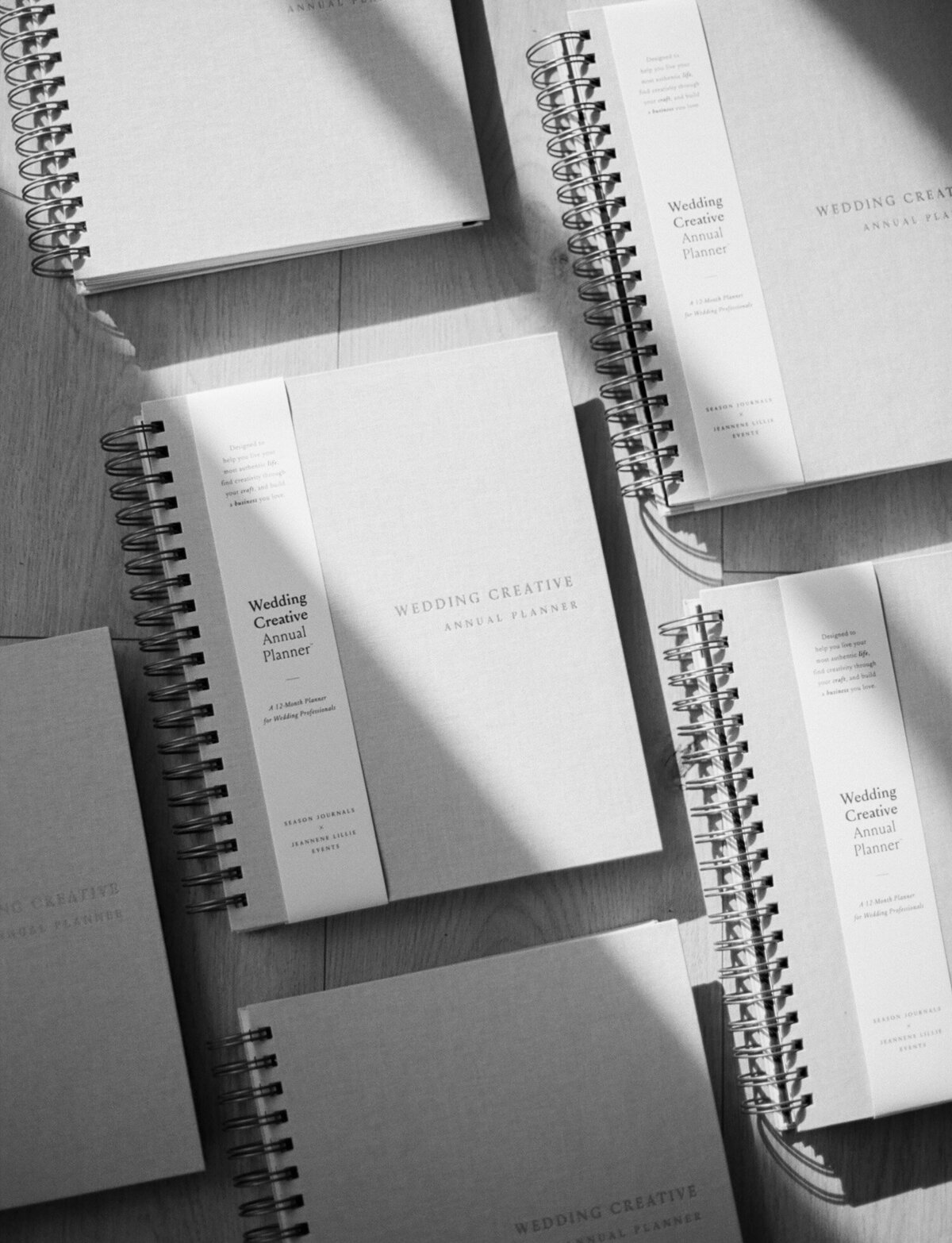 The Wedding Creative Annual Planners in black and white, film product photography, directional light film photo