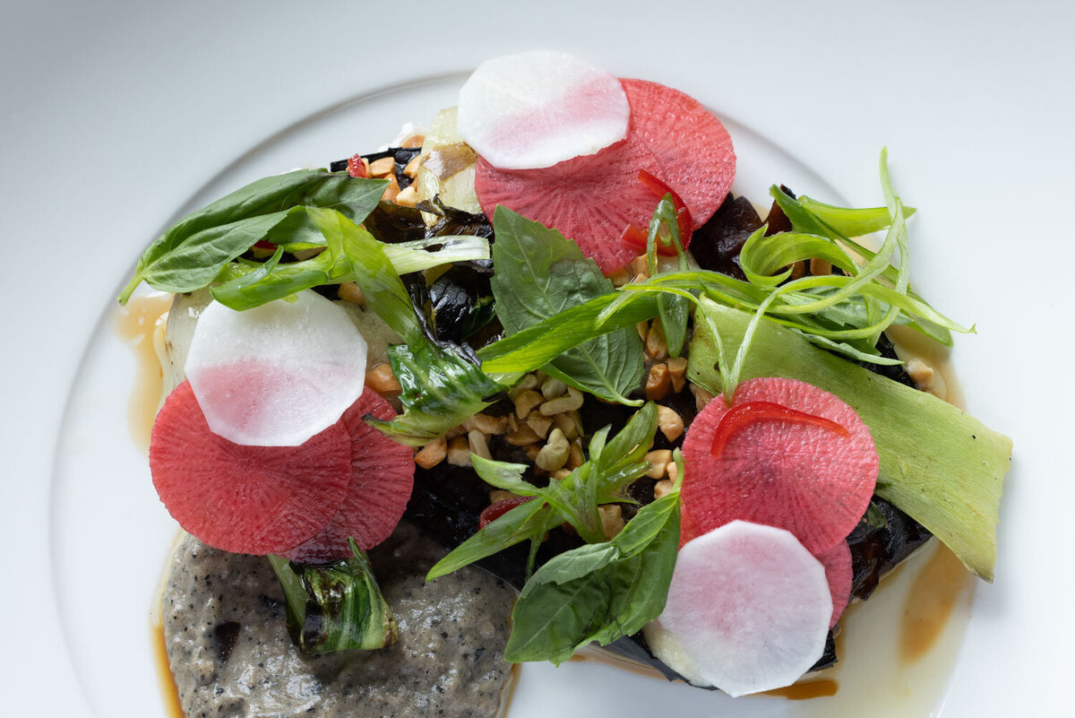 Salad with pink radish slices and fresh greens