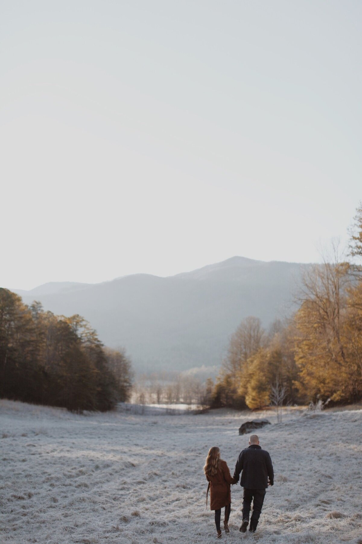 Couple-Winter-Walk-Frosty-Morning-Mountain-Backdrop
