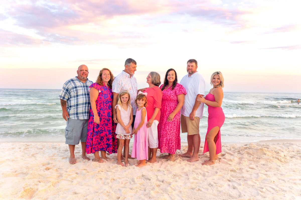 Generations together – an extended family enjoying a golden-hour beach photoshoot.