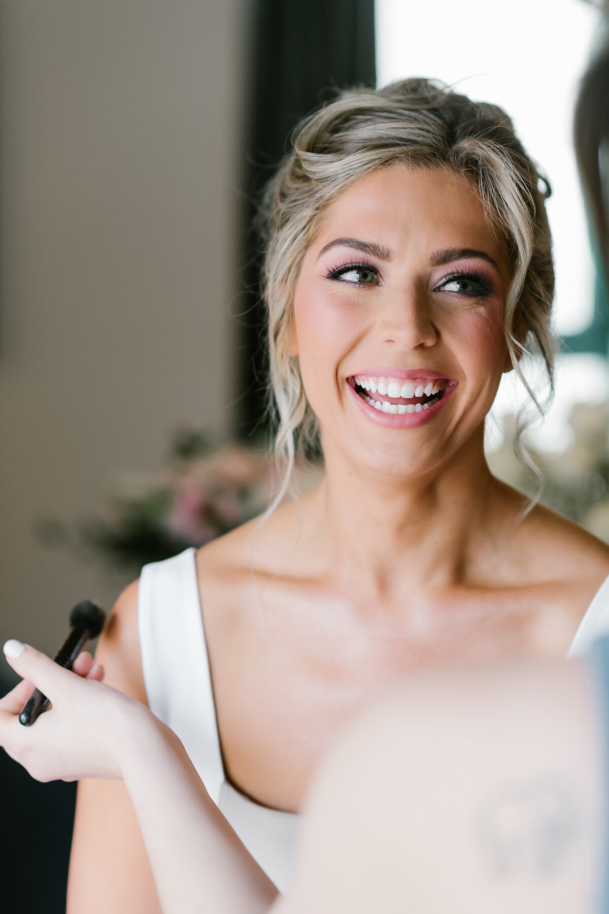 Bride getting hair and make up done