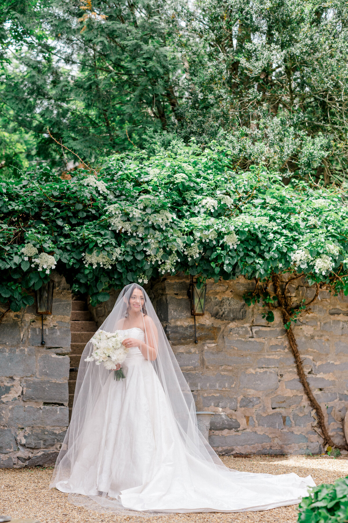 Bride smiling during her Smith Farm Gardens wedding in Connecticut