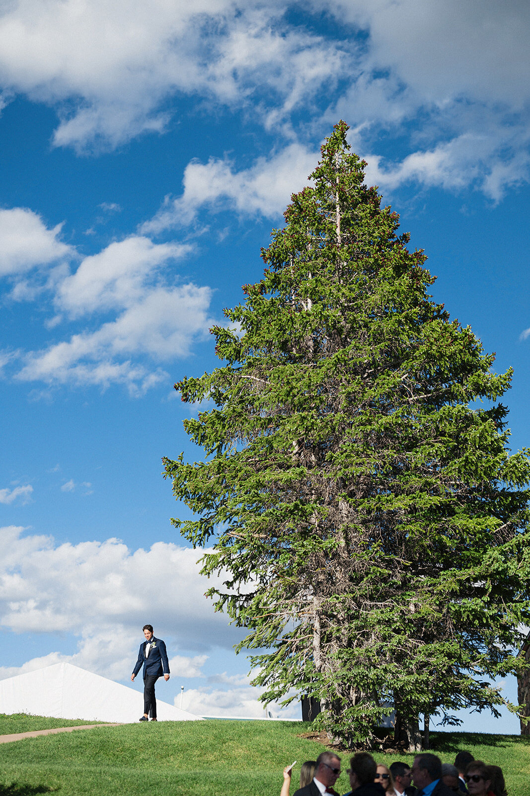 groom-walking-in-ceremony-aspen-HBICWeddings