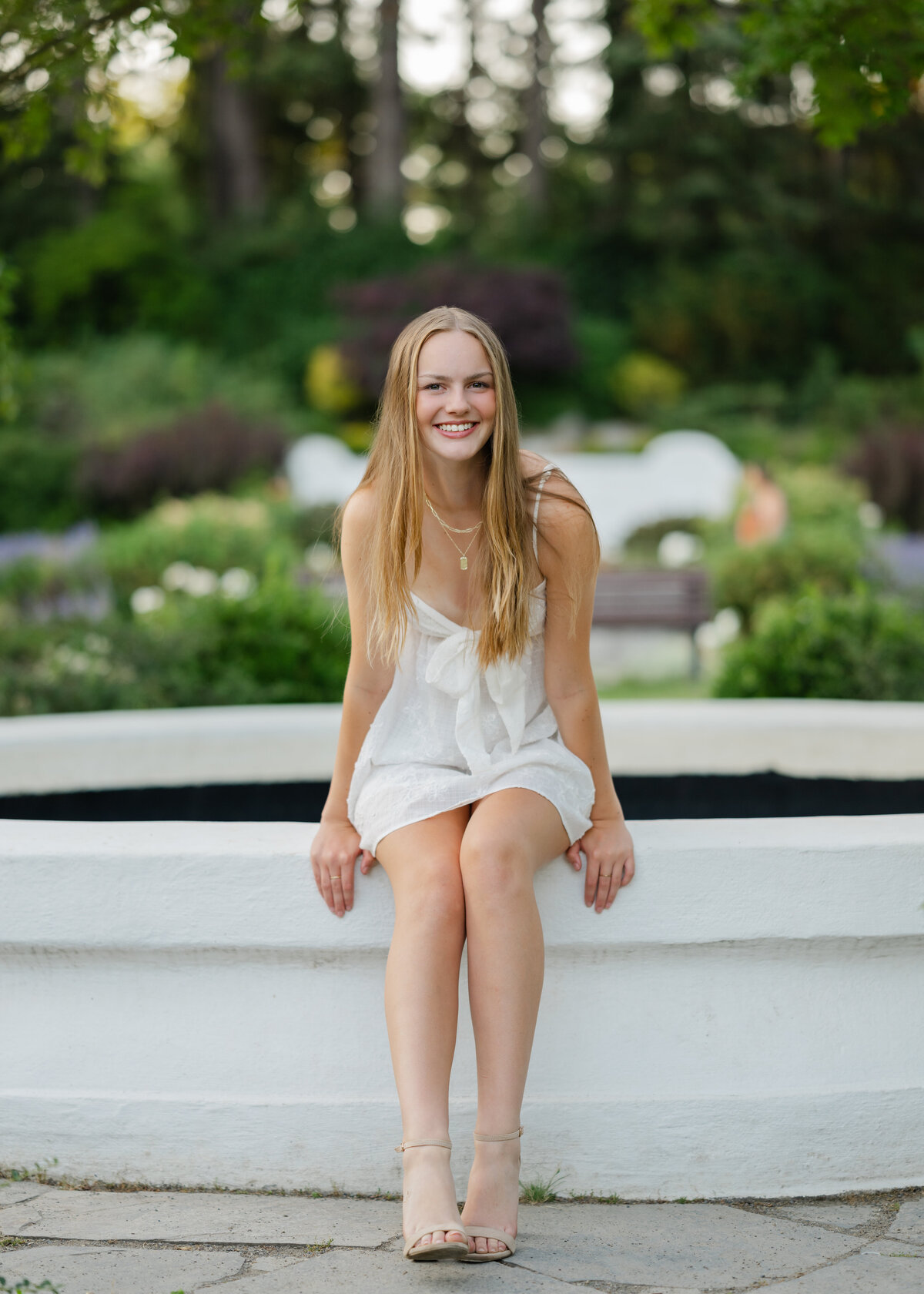 woodland park rose garden high school graduate in white dress