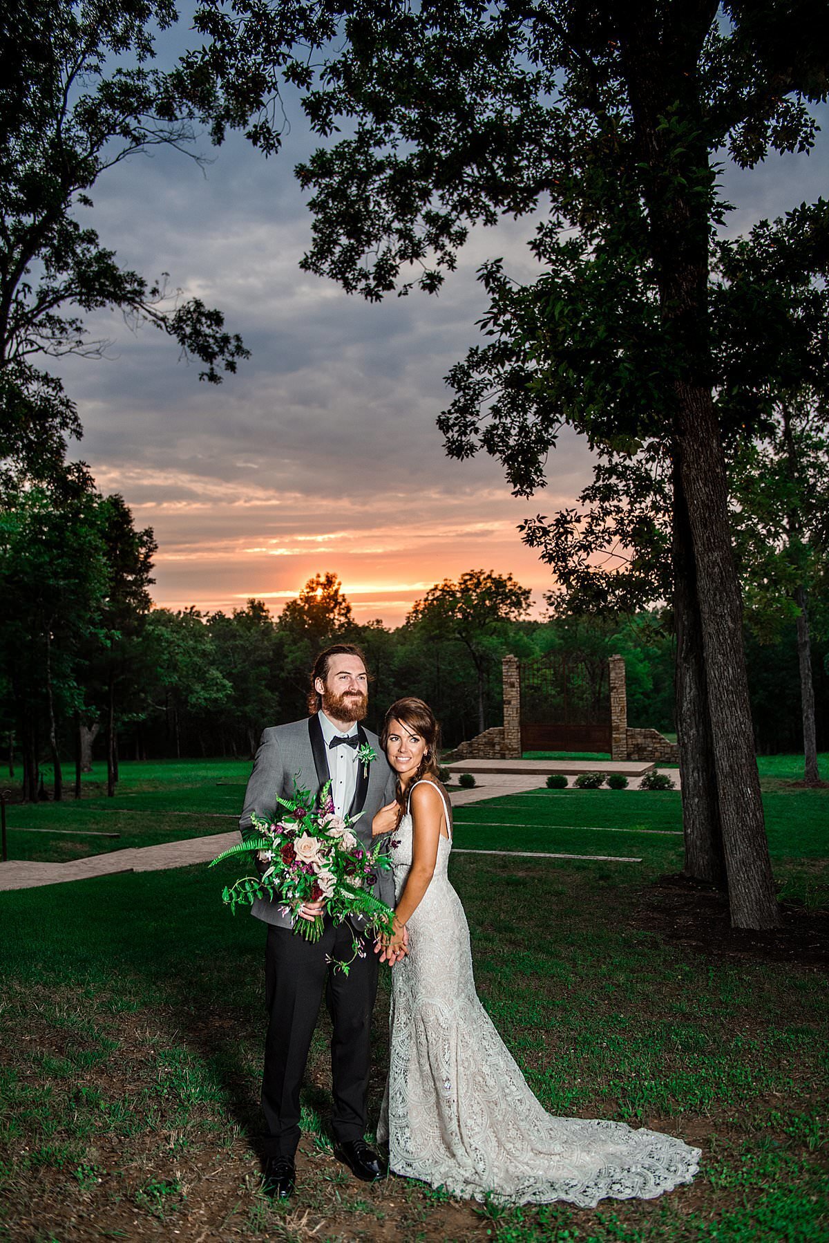 Couple posing together at Stone Gate Farm wedding venue at sunset
