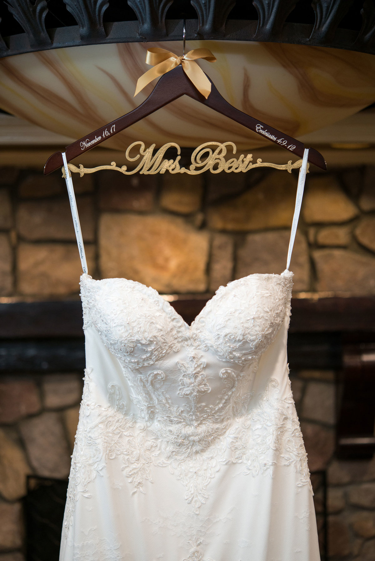 Bride's dress hung up with custom hanger at The Inn at Fox Hollow