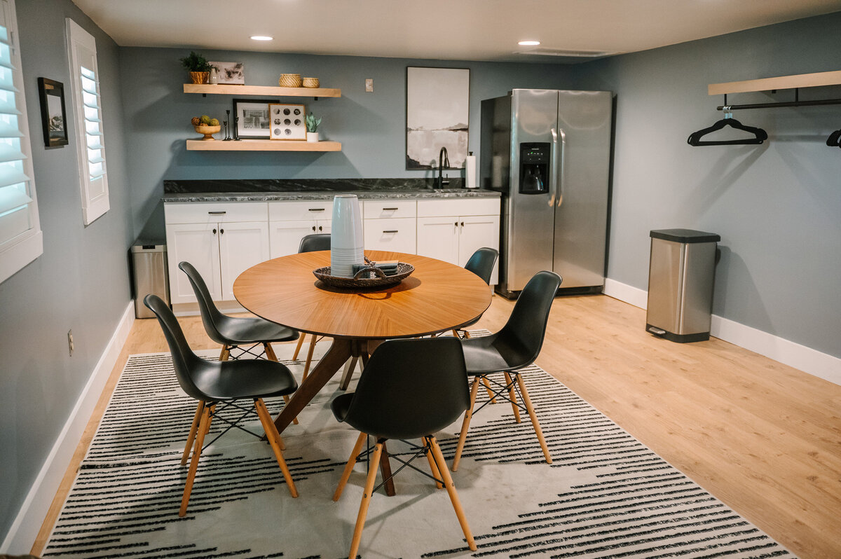 the kitchenette and dining area in the second getting ready suite in the Willowbrook wedding venue preparation cottage