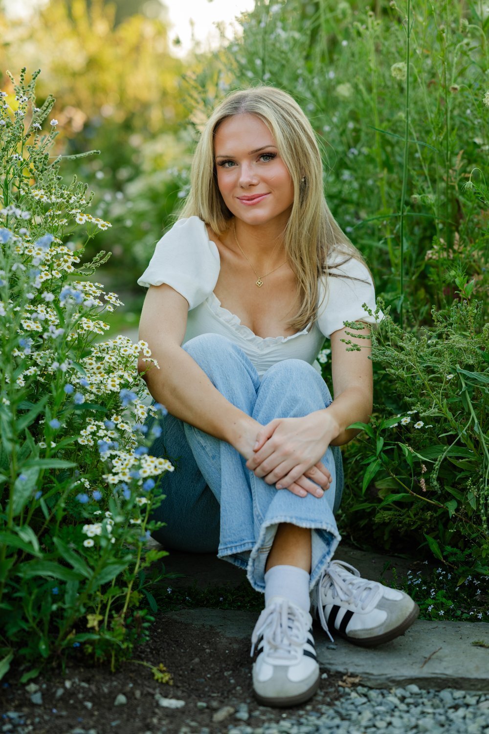 flower farm senior sitting in flowers