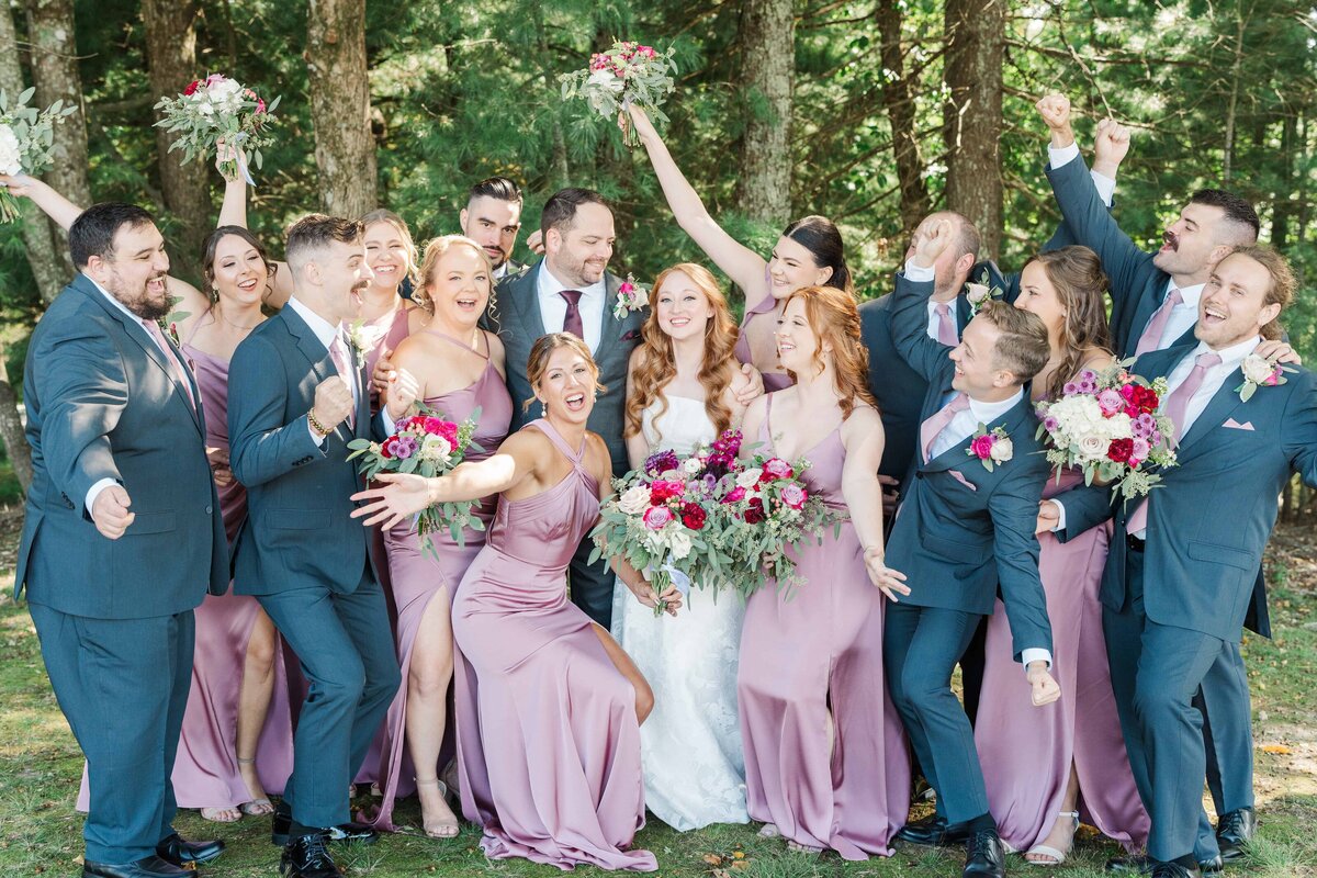 bridal party celebrating the newlyweds at blue ridge mountain wedding