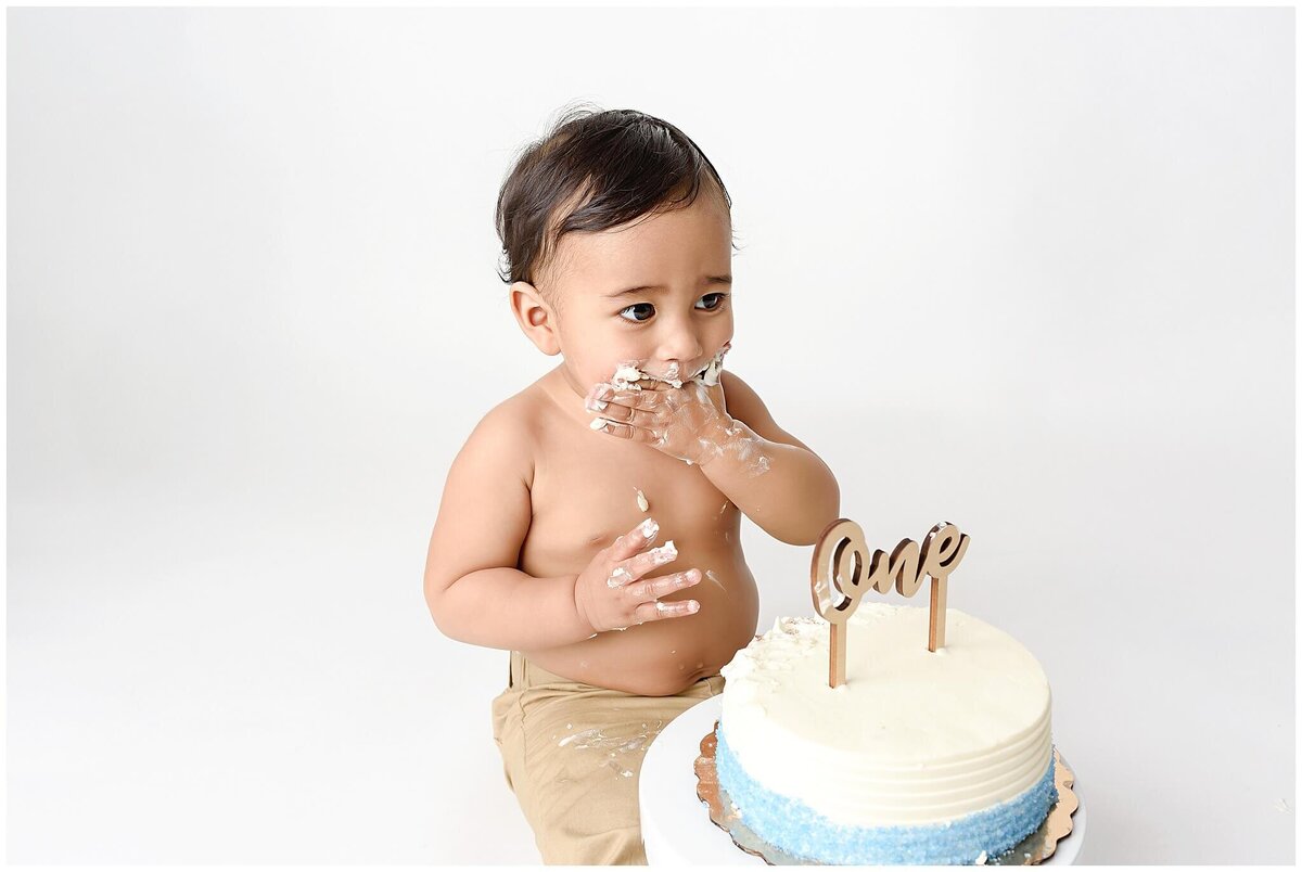 A cake smash session capturing the pure joy and messy fun of a child's first birthday.