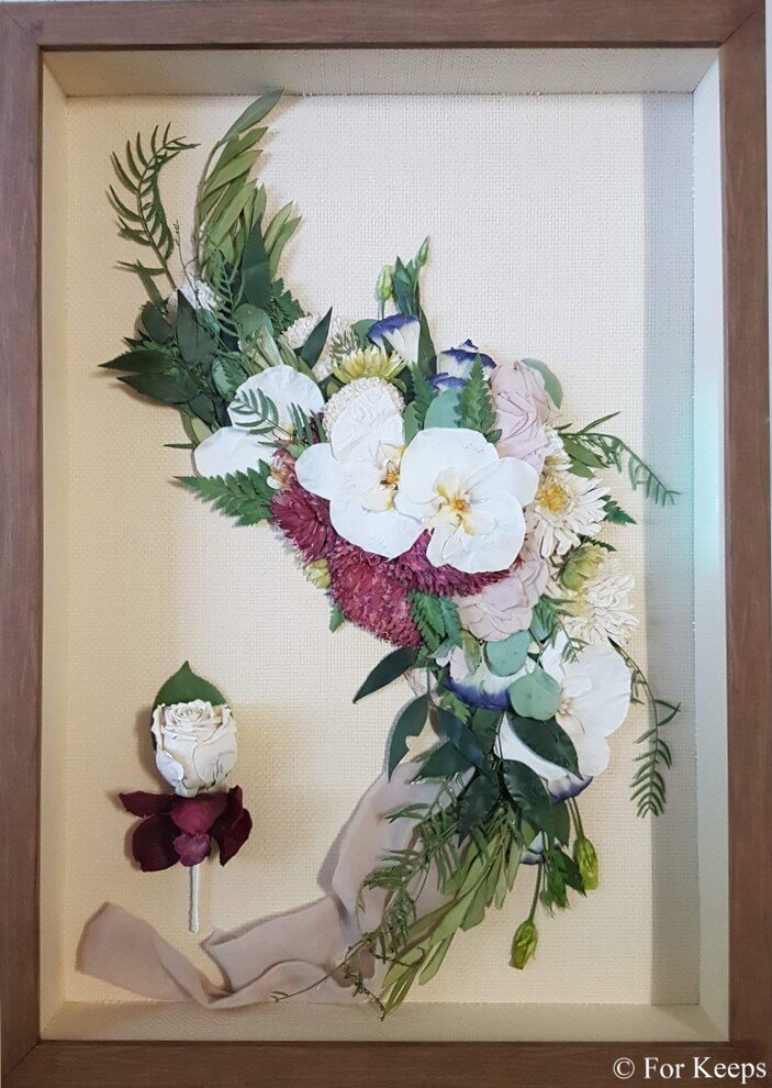 Pressed wedding bouquet in custom frame.