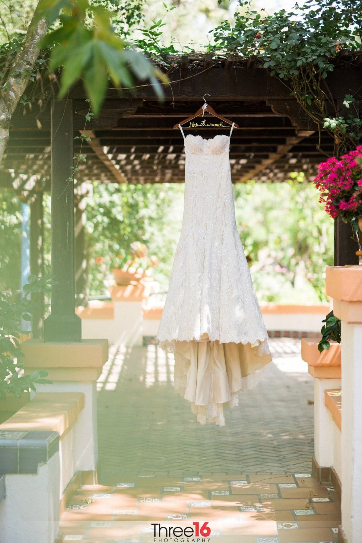 Wedding Gown hangs from the balance