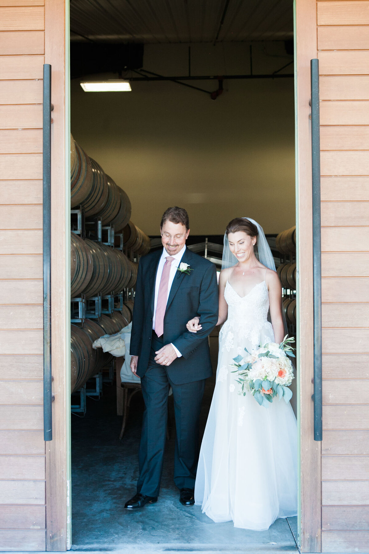 father of the bride walking his daughter down the aisle at ponzi winery wedding