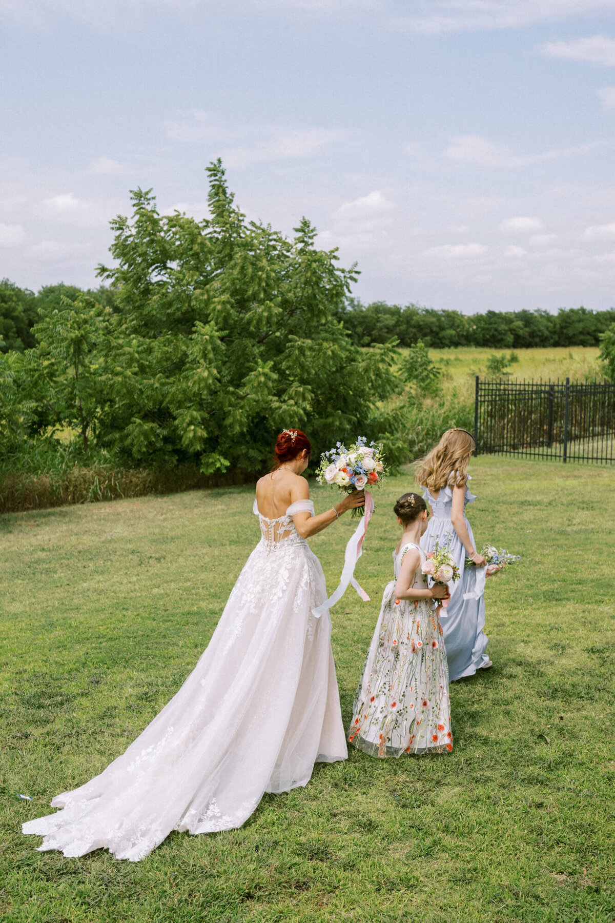 mom-and-daughters-walking-away
