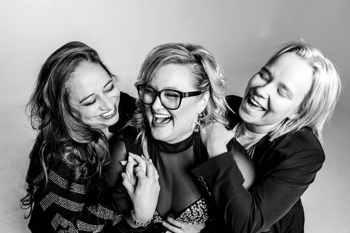 Black and white branding photoshoot for ourdjrocks, with femal fjs laughing