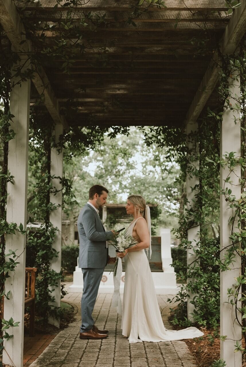 bride & groom exchange vows in private elopement ceremony on 30a