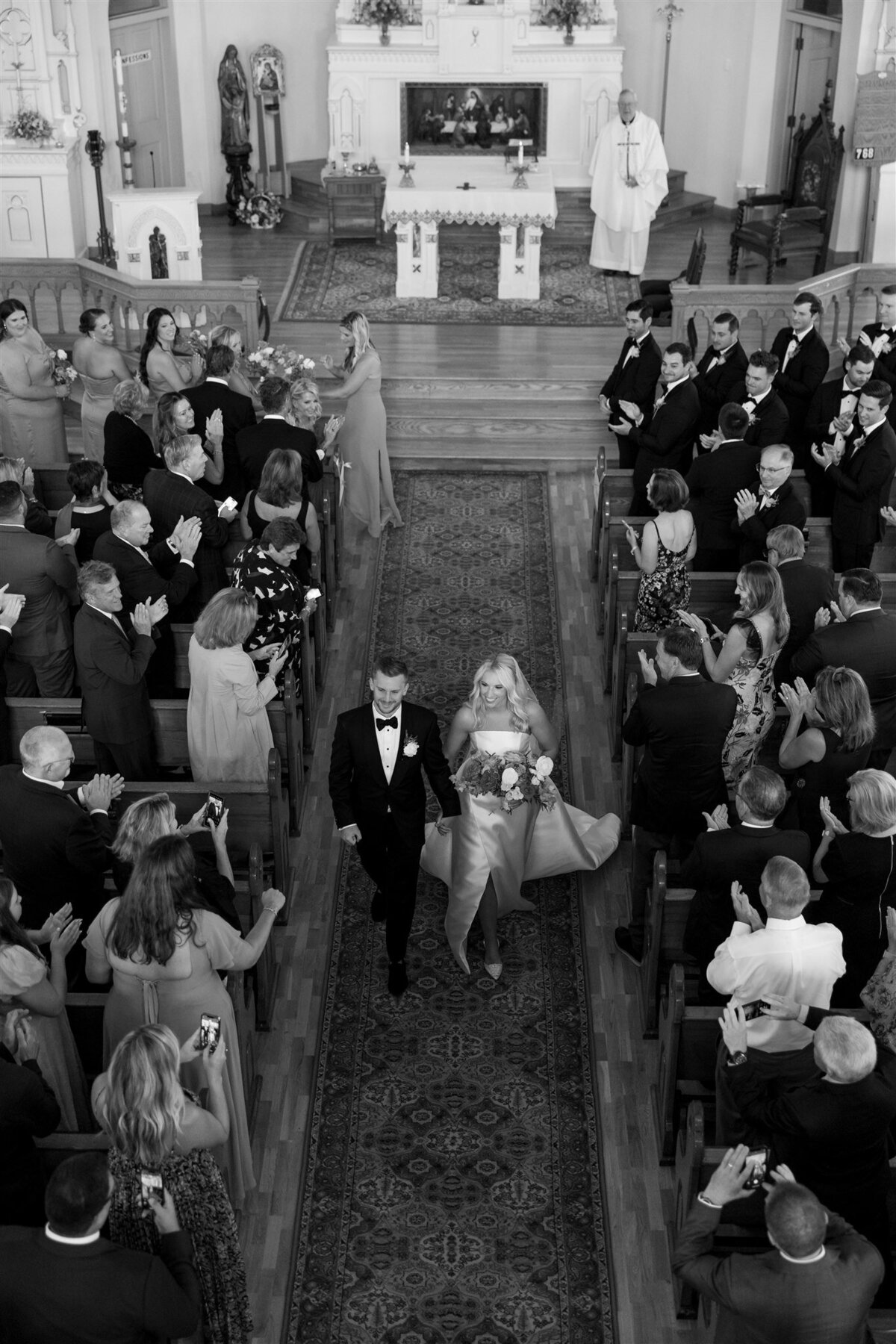 Bride and groom recessional after their St. Anne's Cathedral wedding ceremony