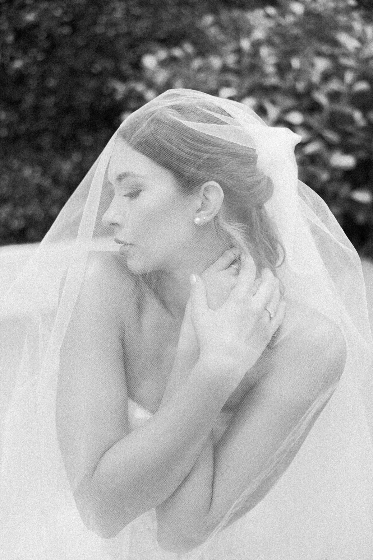 Portrait of a bride under a veil, photographed by Miami wedding photographer Claudia Amalia, showcasing her intimate wedding photography.