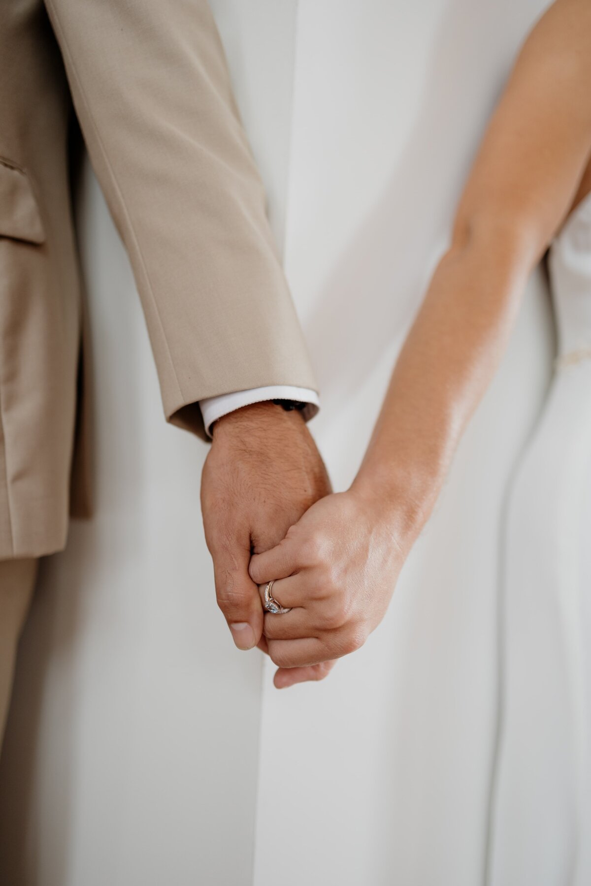 Couple holds hands outside of wedding venue in Nashville