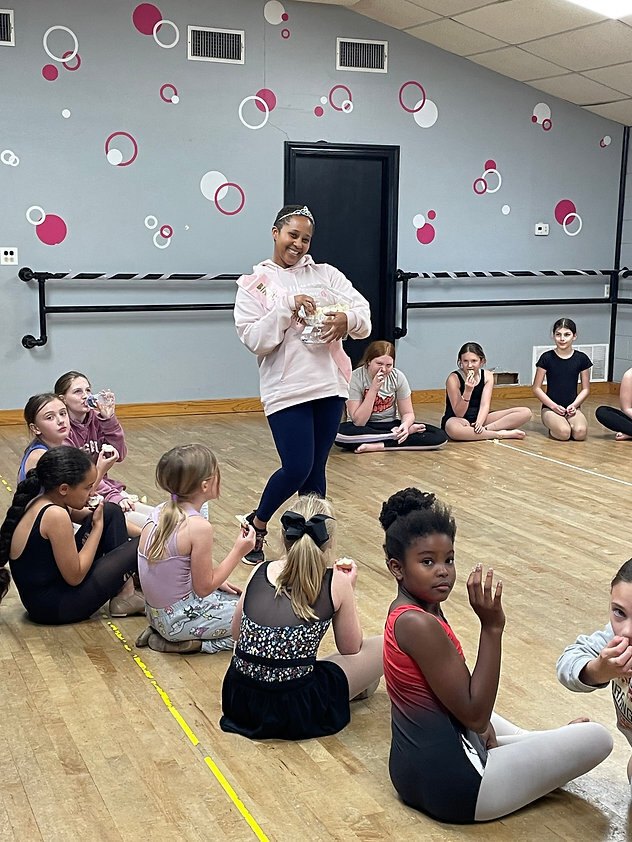 elementary kids with miss tyne celebrating miss tyne birthday